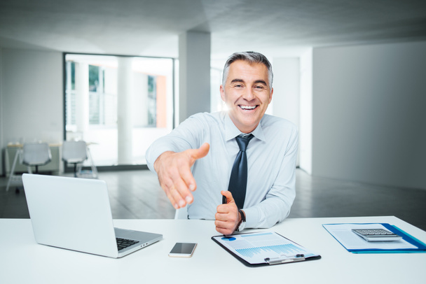 businessman giving a handshake